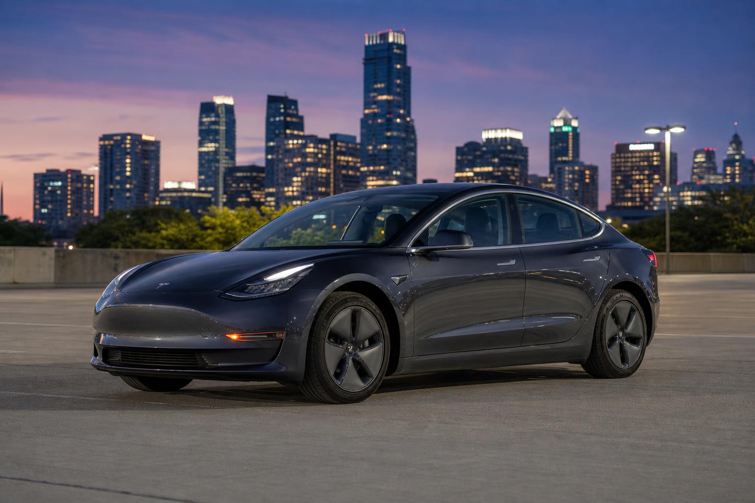 Dark grey 2018 Tesla Model 3 parked in an urban setting